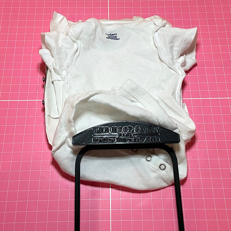 inserting the hoop skirt into the shirt